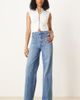 ASOS Tall ASOS DESIGN Tall high rise wide leg jeans with front pockets in mid blue - 1