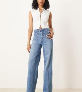 ASOS Tall ASOS DESIGN Tall high rise wide leg jeans with front pockets in mid blue