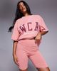 ASOS Weekend Collective Weekend Collective legging shorts with varsity graphic in washed peach - part of a set-Orange - 1