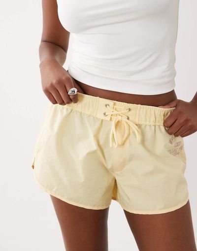 ASOS Weekend Collective Weekend Collective micro nylon short with tie waist detail in buttermilk-Yellow