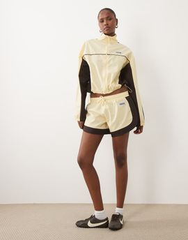 ASOS Weekend Collective Weekend Collective nylon track runner shorts in buttermilk and chocolate - part of a set-Yellow