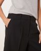 AWARE AWARE pleat front tailored shorts in black - 2