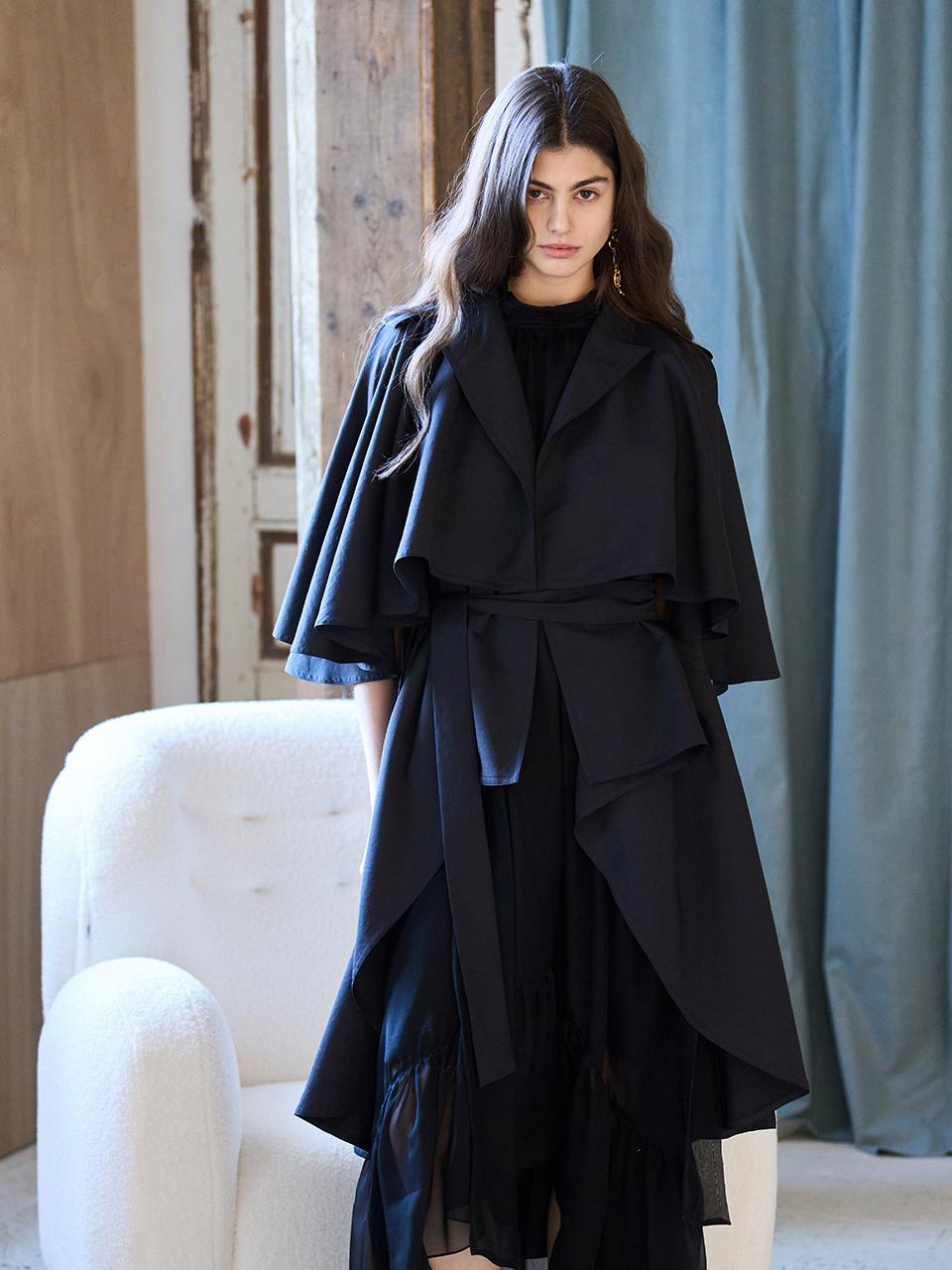 CAHIERS [KAIYE] Loose-fit Cut-out Cape Sleeve Unbalanced Trench Coat [Black]