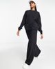 Chelsea Peers Chelsea Peers high waist wide leg sweatpants with woven logo tab in black - 4