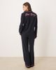 Chelsea Peers Chelsea Peers long button up pajama set with good morning embroidery and wavy trim in navy - 1
