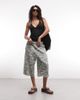 Collusion COLLUSION baggy longline jersey shorts in washed camo-Green - 1