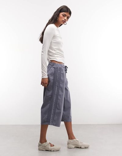 Collusion COLLUSION denim baggy track shorts in mid blue wash