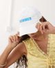 Collusion COLLUSION embroidered slogan cap in white - 1