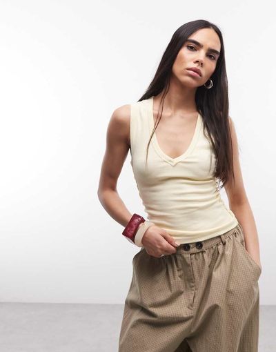 Collusion COLLUSION low v neck exposed seam ribbed tank top in buttermilk-Yellow