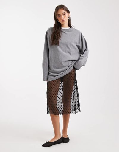 Collusion COLLUSION polka dot sheer mesh awkward length skirt in black