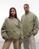 Collusion COLLUSION Unisex utility oversized padded funnel neck jacket in green - 1