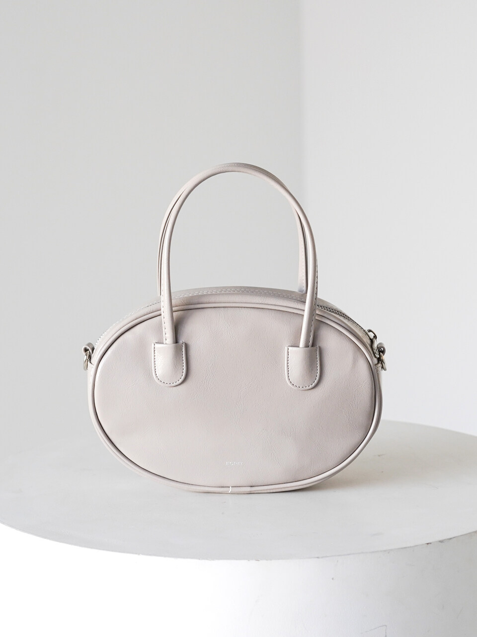 Ecrit Peanut Crossbody Bag - Pale Stone