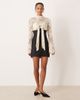 For Love & Lemons For Love & Lemons lace and satin mix long sleeve mini dress with bow bust detail in cream-White - 2