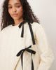 Ghospell Ghospell quilted cropped jacket with tie detailing in cream-White - 3