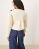 Ghospell Ghospell quilted cropped jacket with tie detailing in cream-White - 4