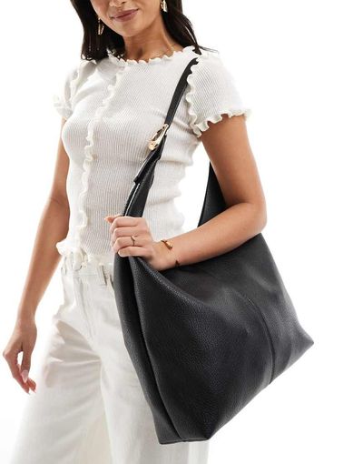 Glamorous Glamorous slouchy shoulder tote bag with molten buckle detail in black