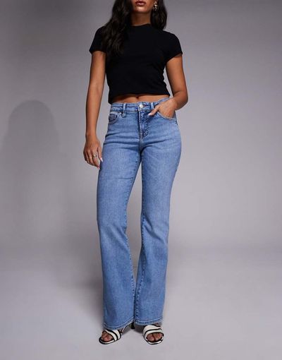 Good American Good American low rise boot cut jeans in mid blue wash