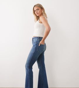 Good American Petite Good American Petite frayed hem flared jeans in mid blue wash