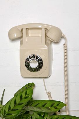 GPO GPO 746 Retro Push Button Dial Landline Wall Mount Phone in Ivory at Urban Outfitters