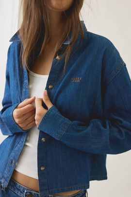 GUESS JEANS GUESS JEANS Logo Embroidered Boxy Denim Button-Down Shirt in Indigo, Women's at Urban Outfitters