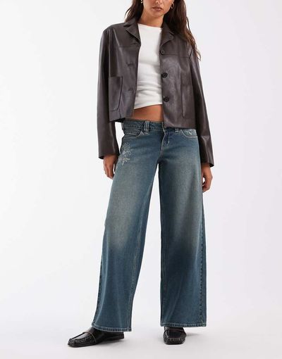 Hollister Hollister ultra low rise baggy fit jeans with embroidery detail in dark blue wash