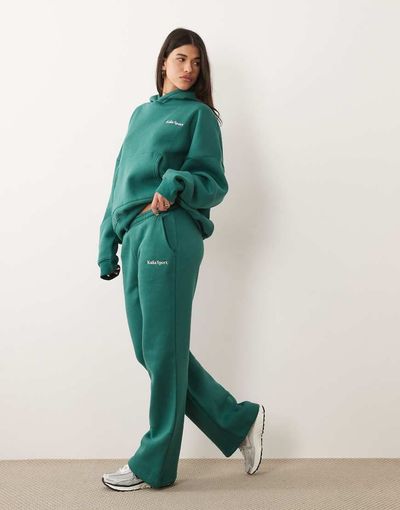 Kaiia Kaiia embroidered logo wide leg sweatpants in dark green and pink - part of a set-Multi