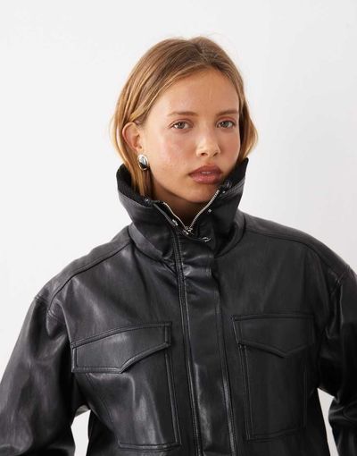 Mango Mango funnel neck cinched waist faux leather jacket in black