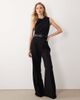 Mango Mango high neck sleeveless jumpsuit with statement belt in black - 1