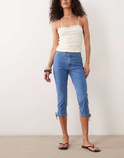 Miss Selfridge Miss Selfridge denim capri pants with bows in mid blue wash