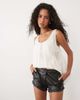 Miss Selfridge Miss Selfridge faux leather frill hem micro shorts in black - 1