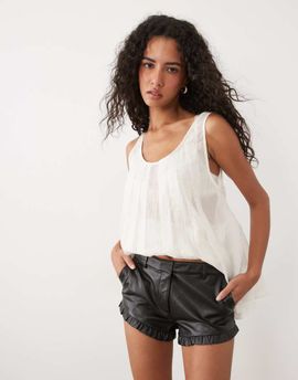 Miss Selfridge Miss Selfridge faux leather frill hem micro shorts in black