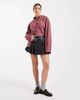Miss Selfridge Miss Selfridge faux leather pleated kilt with buckles in black - 1