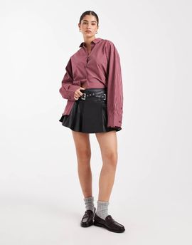 Miss Selfridge Miss Selfridge faux leather pleated kilt with buckles in black