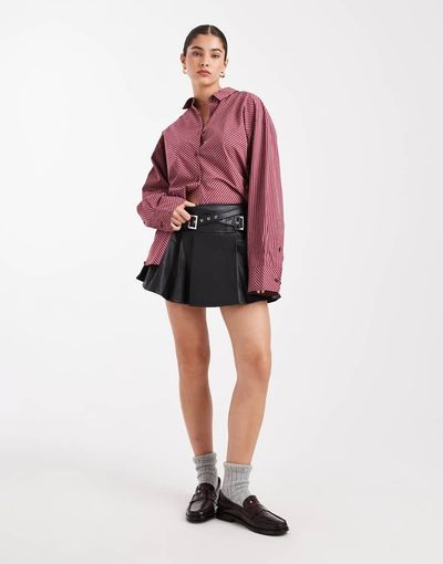 Miss Selfridge Miss Selfridge faux leather pleated kilt with buckles in black