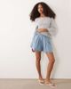 Miss Selfridge Miss Selfridge flared shorts with bow detail in mid blue wash - 1