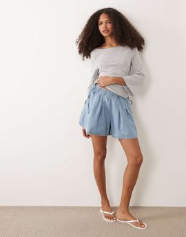 Miss Selfridge Miss Selfridge flared shorts with bow detail in mid blue wash