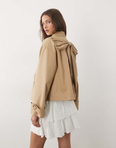 Miss Selfridge Miss Selfridge short trench coat with bow back detail in tan-Neutral