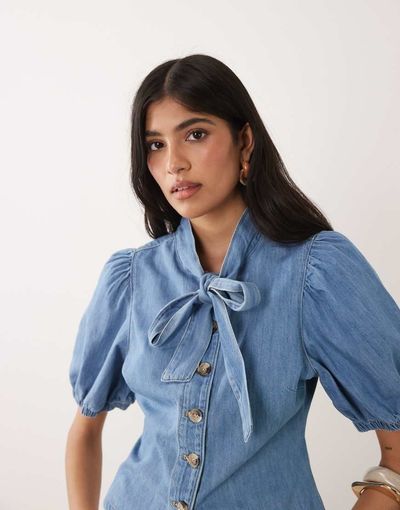 Miss Selfridge Miss Selfridge tie neck puff sleeve denim top in mid blue wash