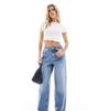 Miss Selfridge Petite Miss Selfridge Petite baggy jeans in mid blue wash - 1
