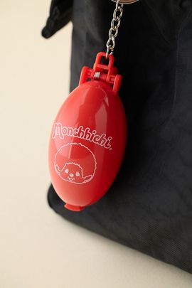 Monchhichi Monchhichi Pocket Pal Wind-Up Capsule Keychain in Red at Urban Outfitters