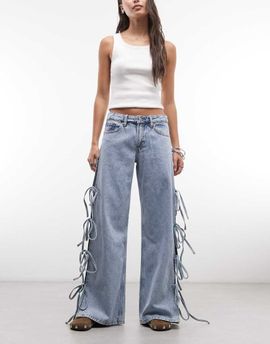 Monki Monki low waist wide leg jeans with side tie bow detailing in blue wash