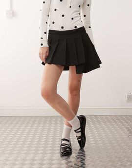 Monki Monki pleated mini skirt with asymmetric hem in black