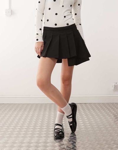 Monki Monki pleated mini skirt with asymmetric hem in black
