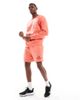 Nike Nike Club French Terry shorts with logo in orange - 1