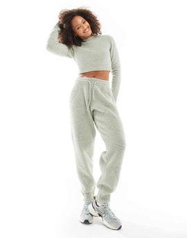 Nike Nike Phoenix Boucle all over print swoosh high-waisted sweatpants in light green