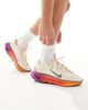 Nike Training Nike Motiva sneakers in white & gold - 1