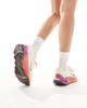 Nike Training Nike Motiva sneakers in white & gold - 4