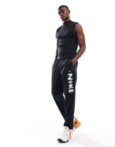 Nike Training Nike Training blurred swoosh graphic sweatpants in black