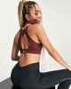 Nike Training Nike Training Dri-FIT Icon Clash all-over print bra in bronze-Brown - 4