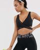 Nike Training Nike Training mesh overlay bra in black - 1